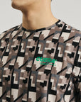 Model wearing Cuera Oncourt Breathe Camou T-Shirt in Camou Green Print, front studio view