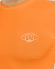 Model wearing Cuera Oncourt LS Layer T-Shirt in Orange, close-up detail on model