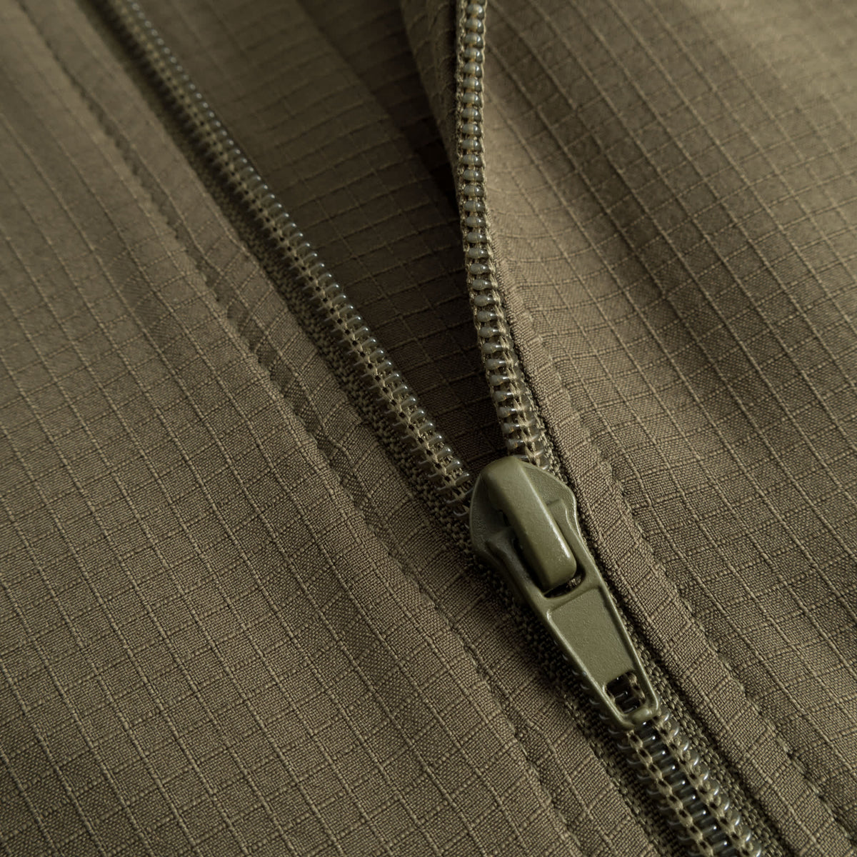 Cuera Active Cuera Track Jacket in Army, zip and pocket detail