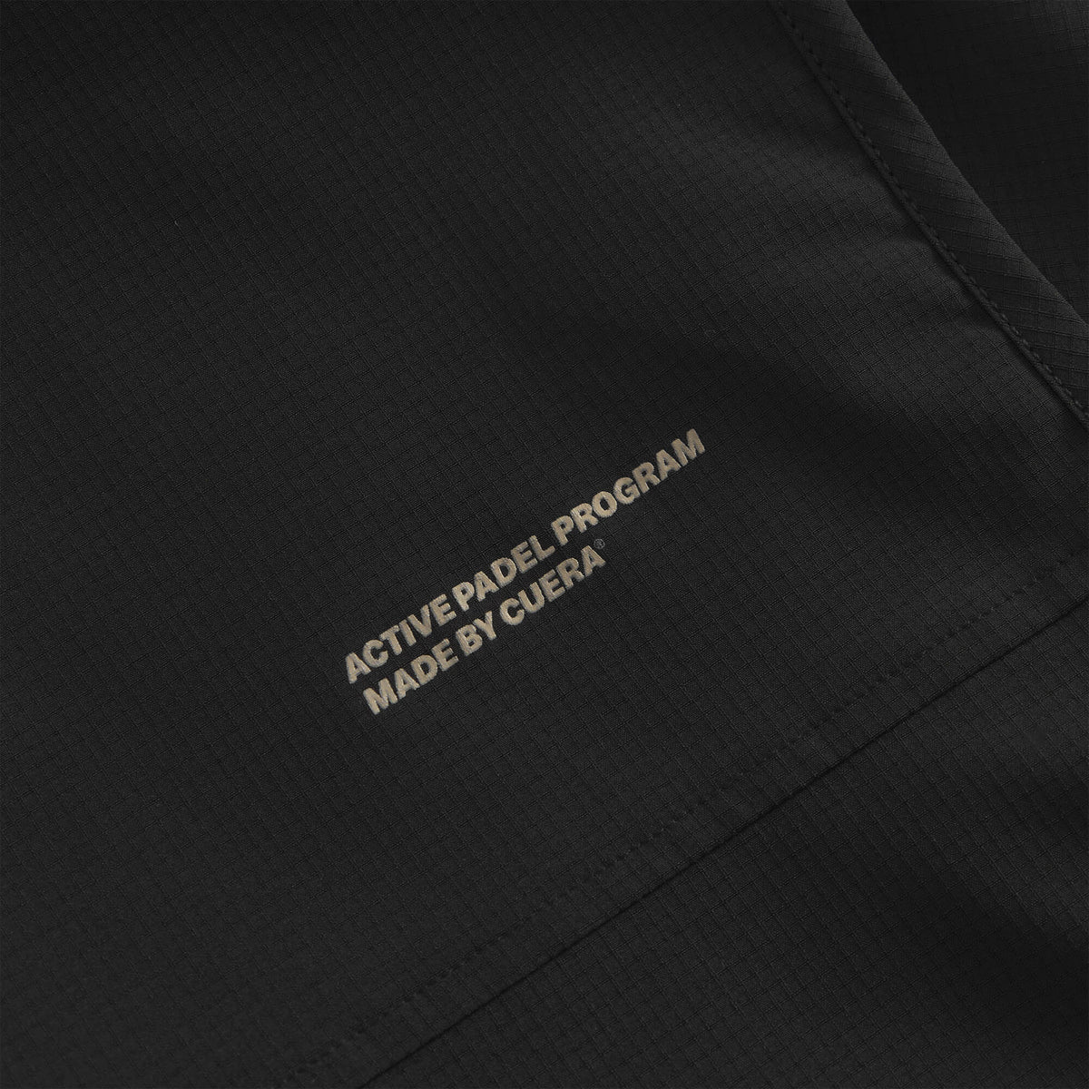Cuera Active Gilet in Black, neck label and care tag detail