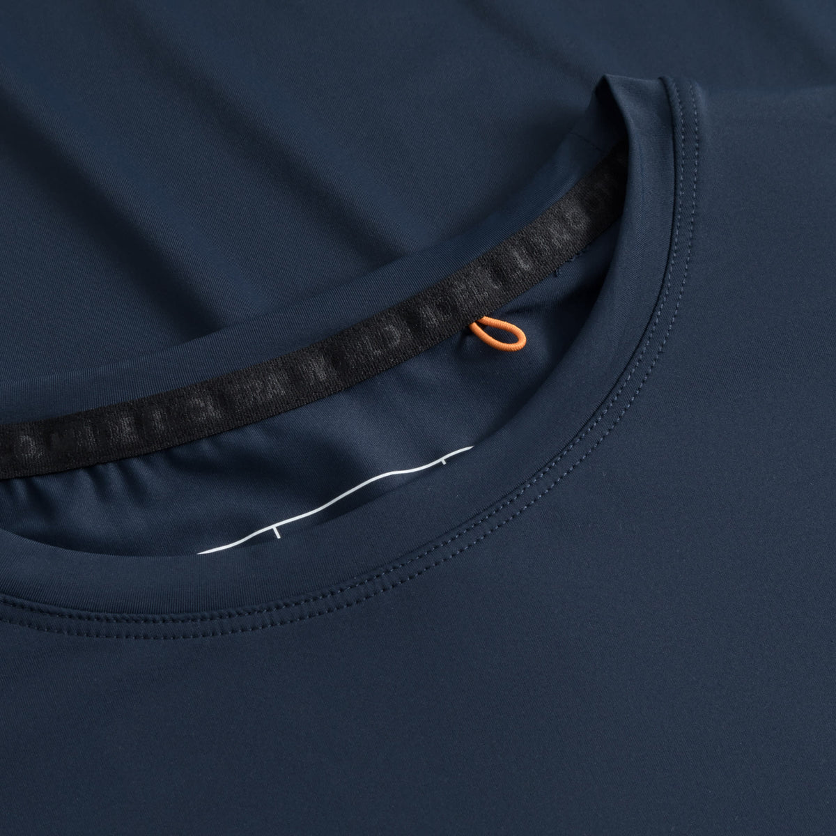 Cuera Active WPC Light Weight T-Shirt in Navy, neck label and care tag detail