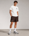 Model wearing Cuera Breathe WPC Unifrom in Off White w. D. Brown, front studio view