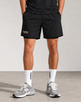 Model wearing Cuera Oncourt 2in1 Shorts & 2-pack socks, front studio view