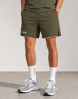 Model wearing Cuera Oncourt 2in1 Shorts Army & 2-pack socks Walnut, front studio view