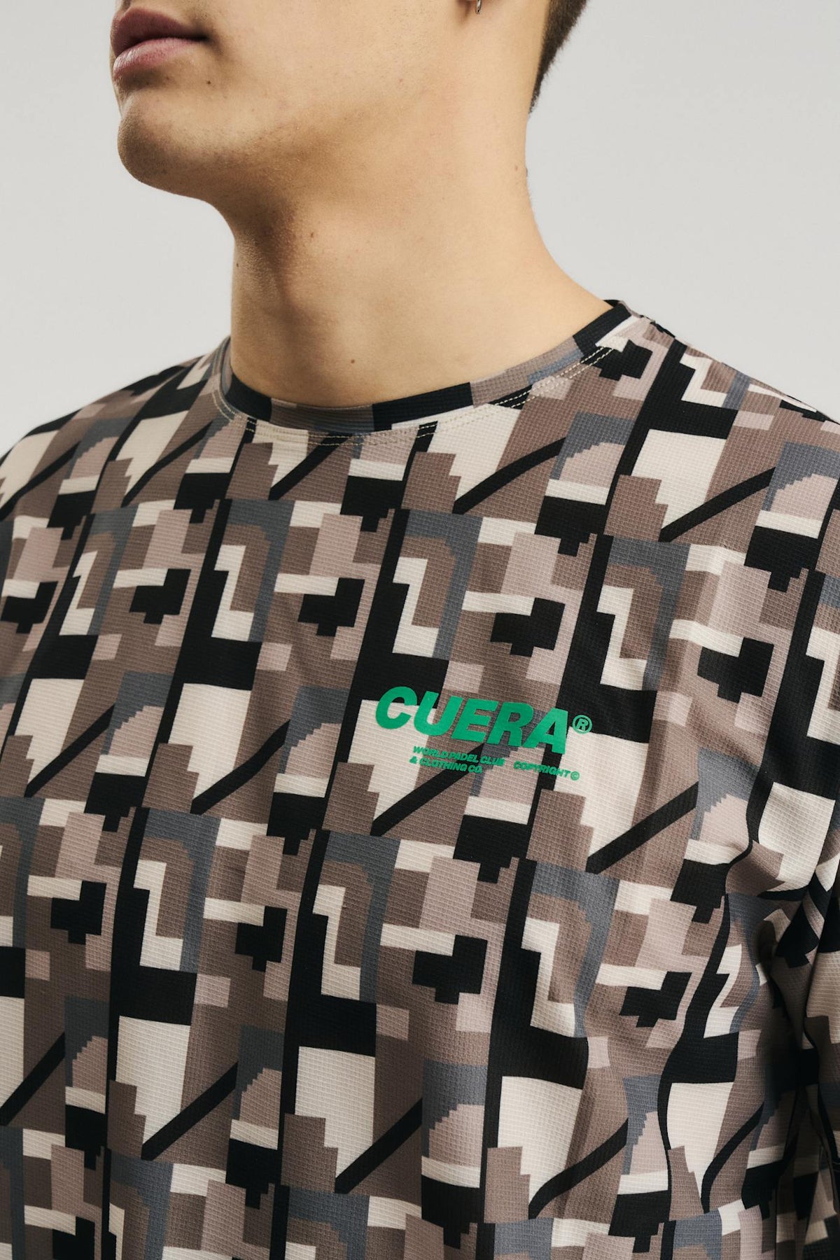 Model wearing Cuera Oncourt Breathe Camou T-Shirt in Camou Green Print, front studio view