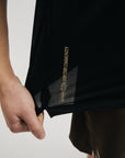 Model wearing Cuera Oncourt Breathe Cuera T-Shirt in Black, close-up detail on model