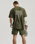 Model wearing Cuera Oncourt Breathe WPC T-Shirt in Army, lifestyle action shot on the padel court