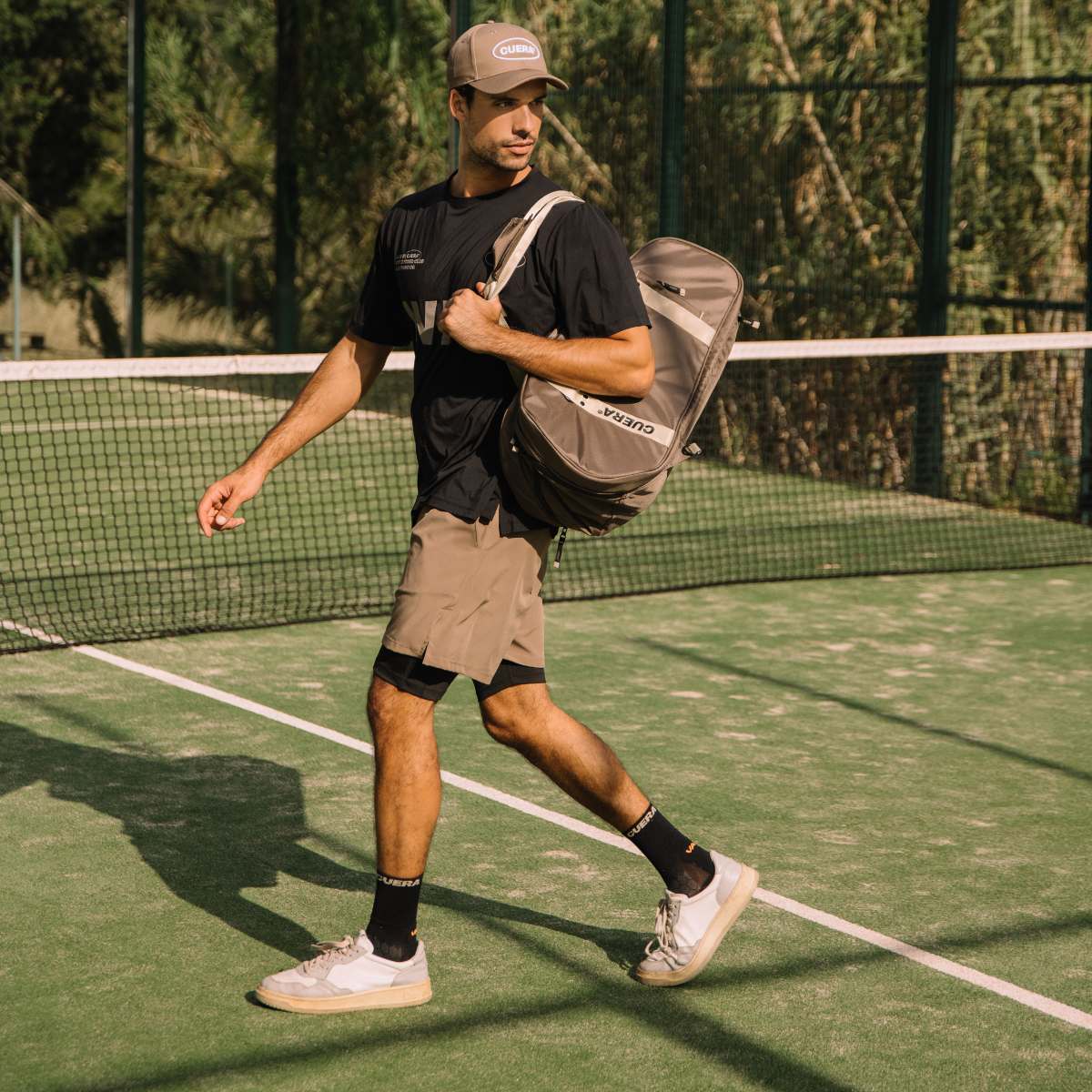 Model wearing Cuera Oncourt Grip Sock in Black, front studio view