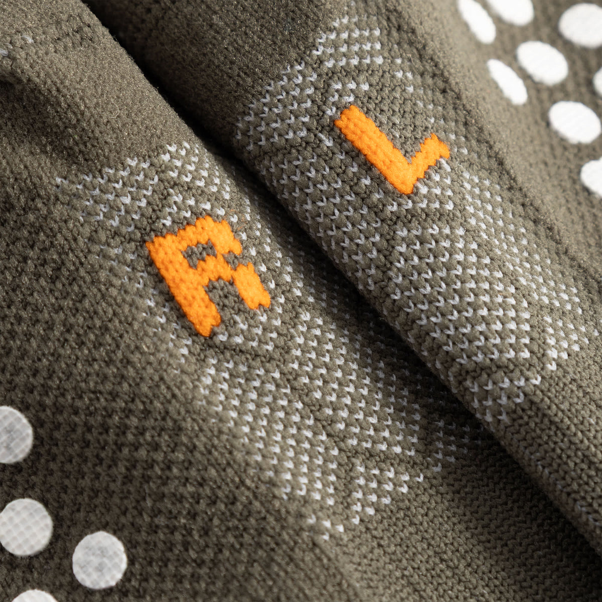 Cuera Oncourt Grip Sock in Army, neck label and care tag detail