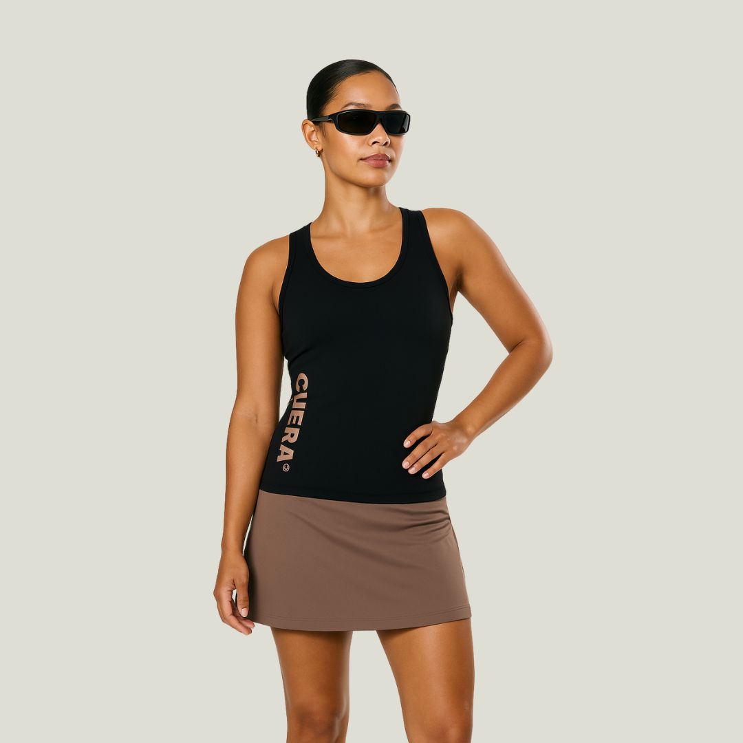 Model wearing Cuera Oncourt Slim Tank Top & Oncourt Cuera Skirt 2-in-1, front studio view