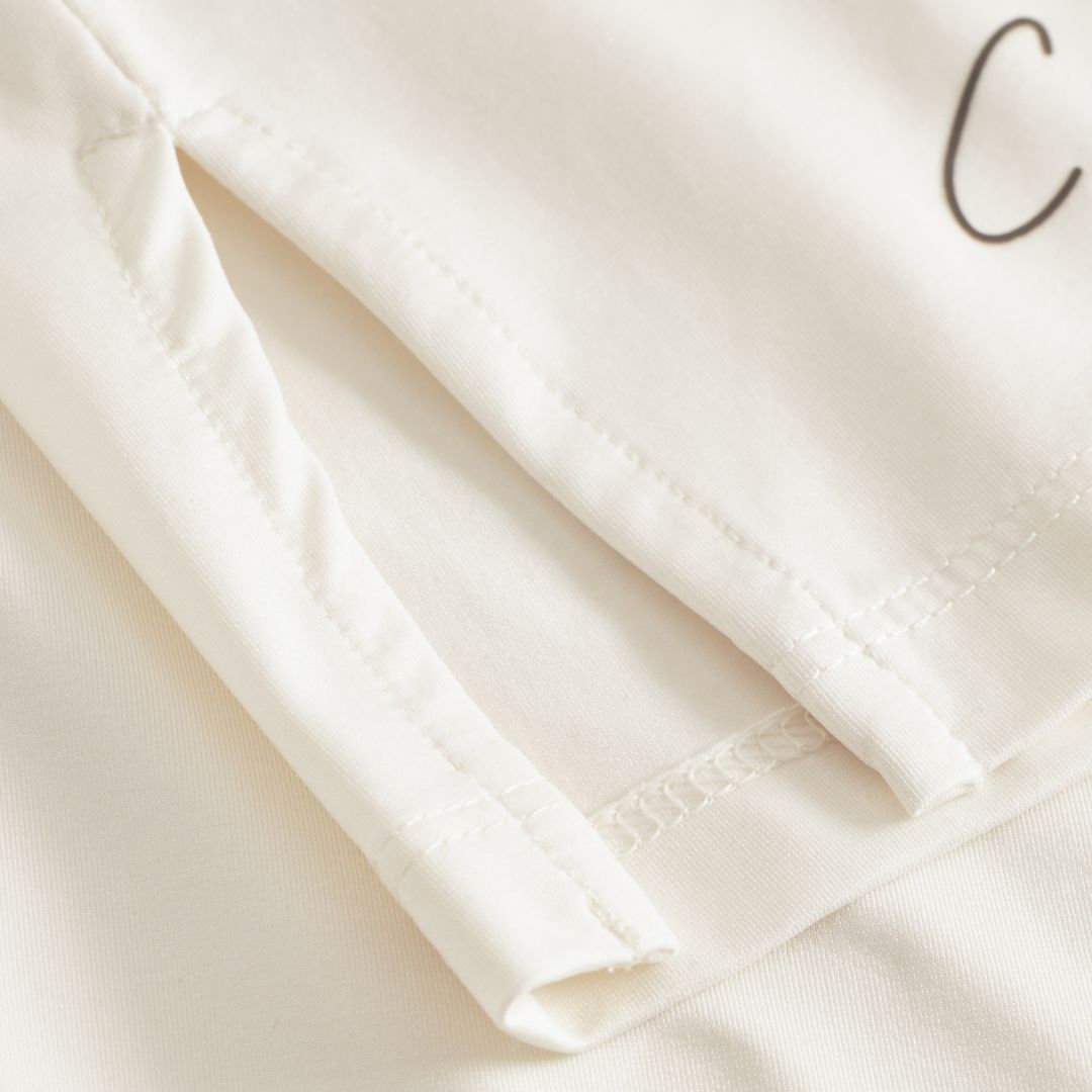 Cuera Oncourt Slit Top SS in Off White, seam and stitching detail